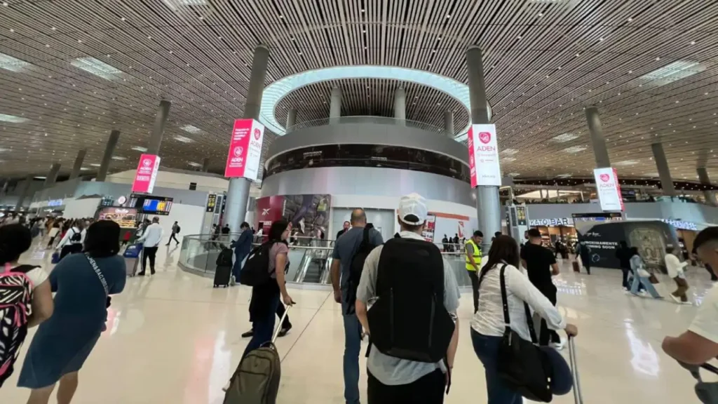 Tocumen International Airport busy terminal showing crowds and airline activity.