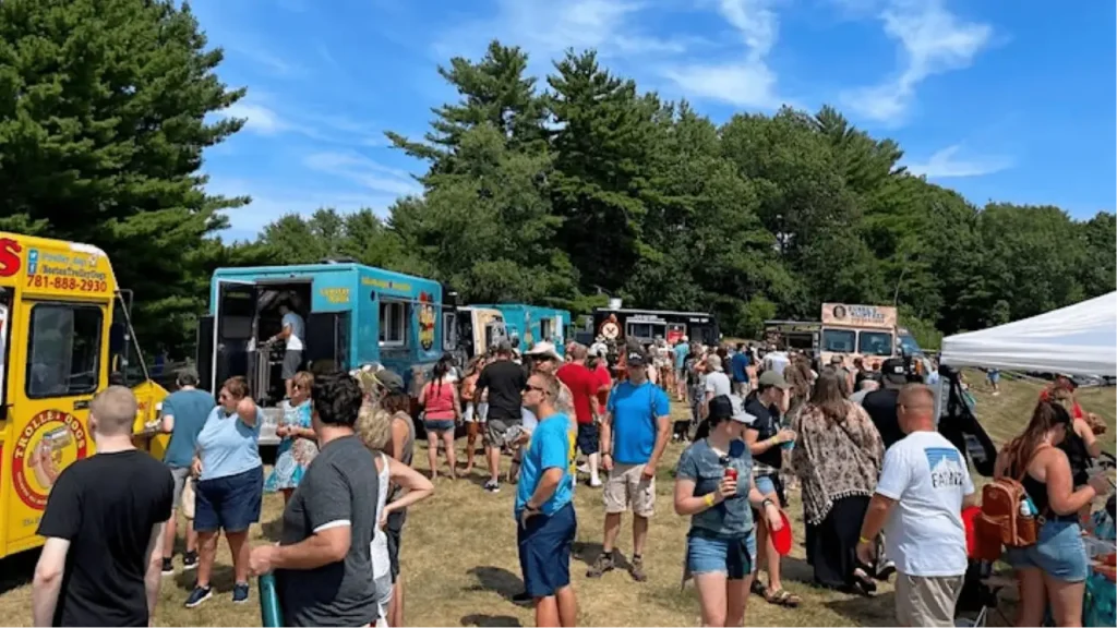 People enjoying local food and lively community events with smiles.